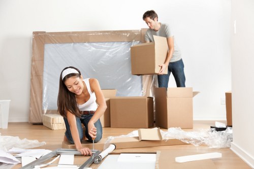 Same day removal team loading boxes in Holland Park