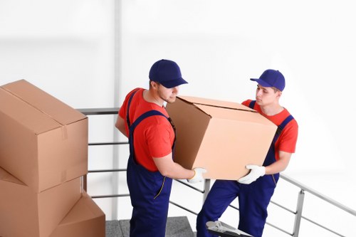 Local moving team handling furniture transport near Holland Park