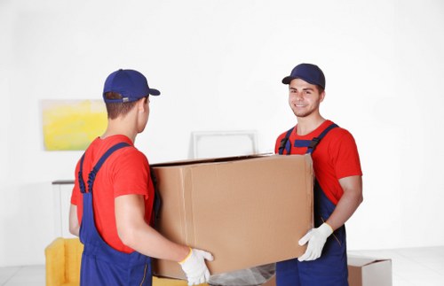 Removalists helping with a family home move in Holland Park