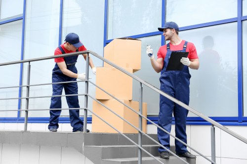 Professional house removal service handling stairs and narrow access in Holland Park