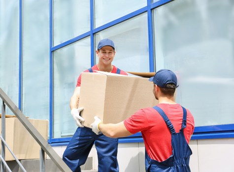 Removal van team preparing careful move in Holland Park