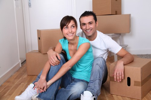 Packed office boxes and furniture prepared for relocation in Holland Park