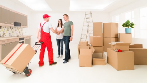 Packed boxes and furniture ready for a Holland Park relocation