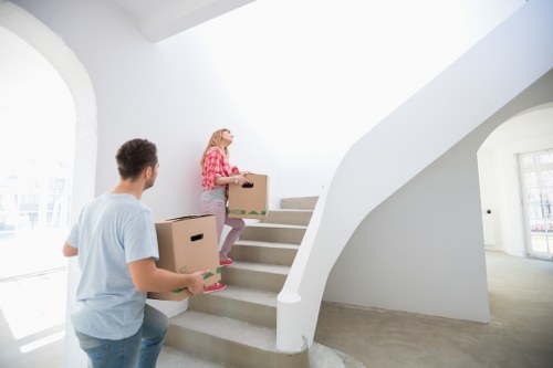 Wrapped sofa and boxed items prepared for furniture removals in Holland Park